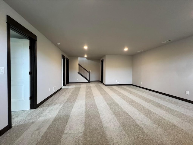 1232 Berkshire Ln, North Liberty, IA 52317 - spare room with recessed lighting, light carpet, baseboards, and stairway