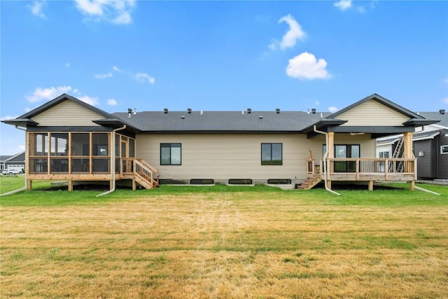 1232 Berkshire Ln, North Liberty, IA 52317 - rear view of property featuring a sunroom, a lawn, and a deck