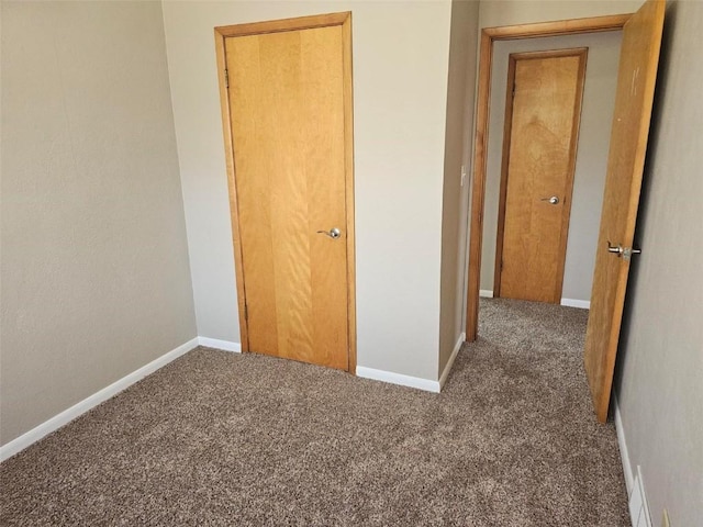 2704 Otis Rd SE, Cedar Rapids, IA 52403 - unfurnished bedroom with carpet floors and baseboards