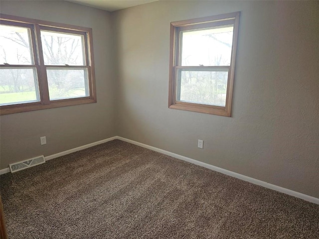 2704 Otis Rd SE, Cedar Rapids, IA 52403 - carpeted empty room with healthy amount of natural light and baseboards
