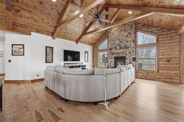 living area featuring wooden ceiling, high vaulted ceiling, light wood-style floors, and ceiling fan