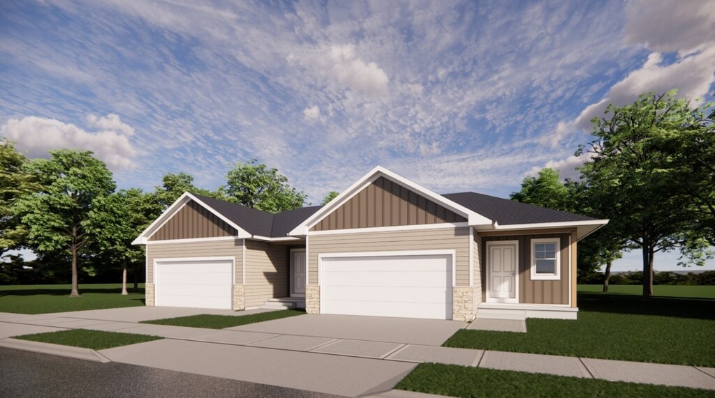 7112 Waterview Dr, Cedar Rapids, IA 52404 - view of front of house with board and batten siding, a front lawn, stone siding, and a garage