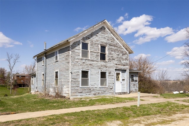 408 W Green St, Wyoming, IA 52362 - view of front of property featuring a front yard