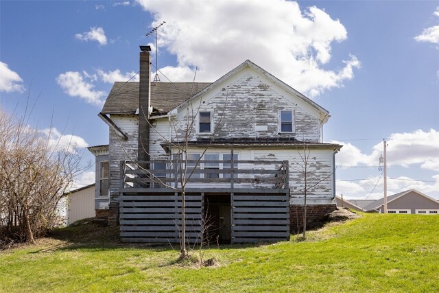 408 W Green St, Wyoming, IA 52362 - back of property featuring a chimney, a wooden deck, stairway, and a yard