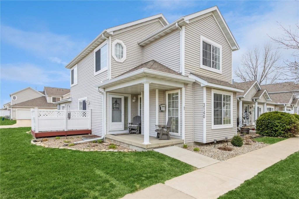 view of front of home featuring a porch and a front yard