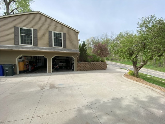 view of side of property featuring driveway