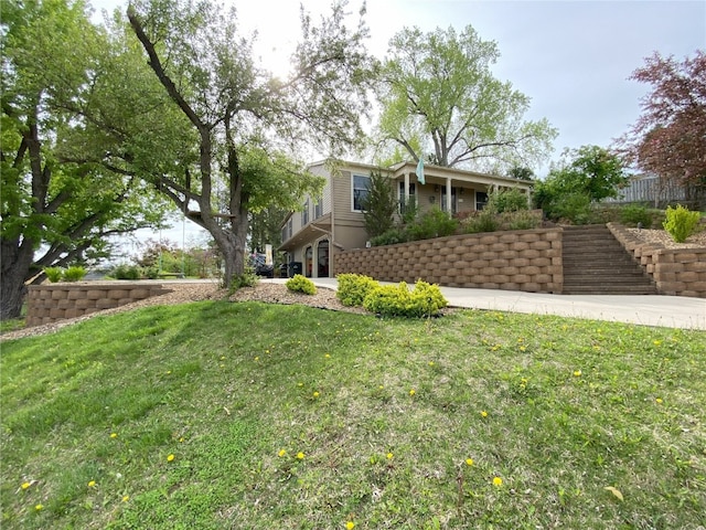 view of home's exterior featuring a yard