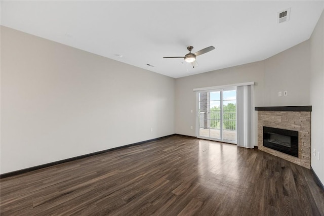 2873 Spring Rose Cir Unit 206, Coralville, IA 52241 - unfurnished living room with dark wood-style floors, a ceiling fan, and a stone fireplace