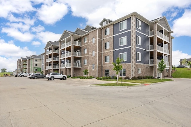 2873 Spring Rose Cir Unit 206, Coralville, IA 52241 - view of apartment building / complex featuring uncovered parking