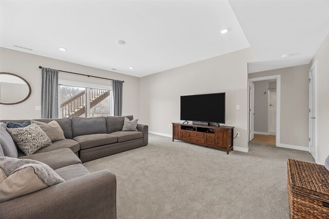 919 Camp Cardinal Rd, Iowa City, IA 52246 - living room featuring light carpet, baseboards, visible vents, and recessed lighting