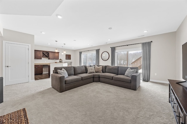 919 Camp Cardinal Rd, Iowa City, IA 52246 - living area with recessed lighting, baseboards, and light carpet
