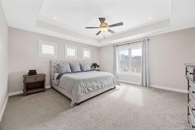 919 Camp Cardinal Rd, Iowa City, IA 52246 - bedroom with light colored carpet, baseboards, a tray ceiling, and recessed lighting