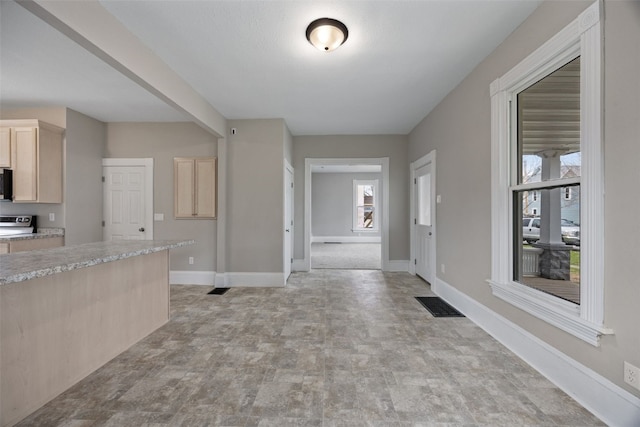 entryway featuring baseboards