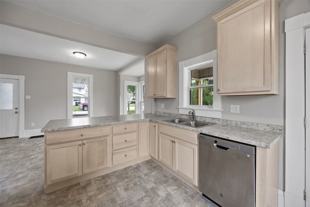 kitchen with dishwasher, light brown cabinetry, a sink, a peninsula, and plenty of natural light
