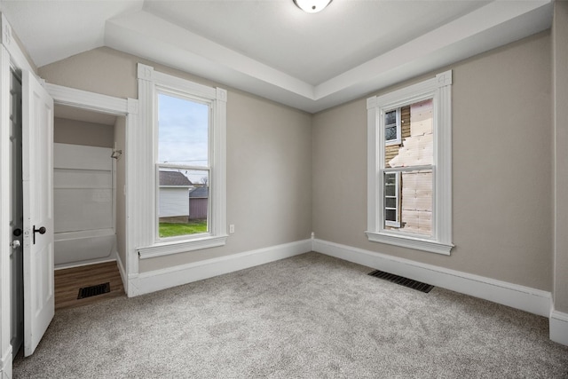 carpeted spare room with baseboards