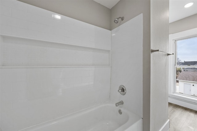 full bathroom with shower / bathtub combination and wood finished floors