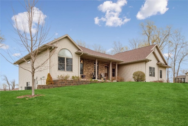 ranch-style home with a front yard, a porch, a garage, and central AC