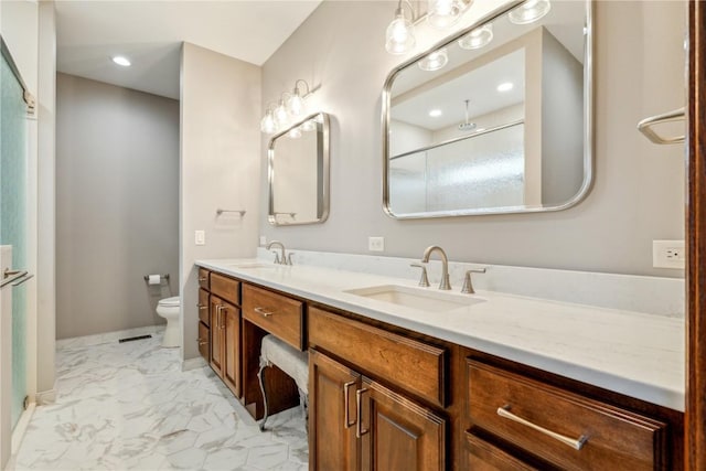 bathroom with marble look tiles, toilet, double vanity, recessed lighting, and baseboards