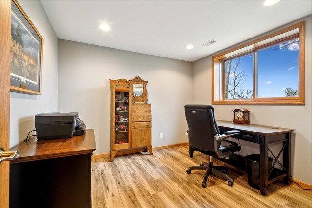 office space with light wood finished floors, baseboards, and recessed lighting