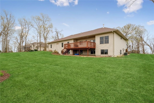 rear view of property featuring a wooden deck, stairs, a yard, and central AC unit