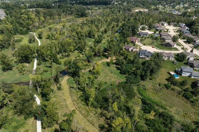 aerial view featuring a view of trees and a residential view