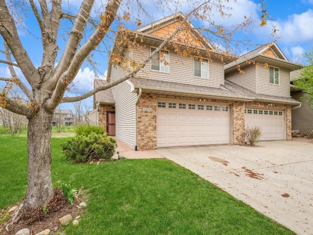 view of front of property with a garage, driveway, a front yard, brick siding, and roof with shingles
