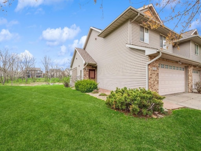 view of home's exterior with a garage, a lawn, and concrete driveway