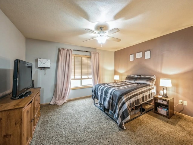 carpeted bedroom featuring a ceiling fan and baseboards