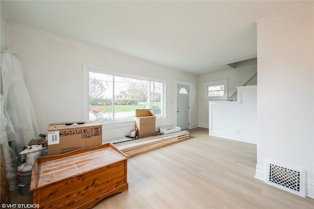 802 22nd Ave SW, Cedar Rapids, IA 52404 - living room featuring wood finished floors and crown molding