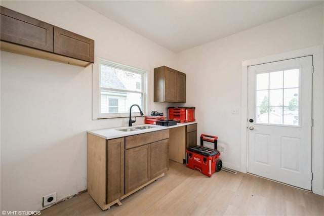 802 22nd Ave SW, Cedar Rapids, IA 52404 - kitchen with light wood finished floors, healthy amount of natural light, and light countertops