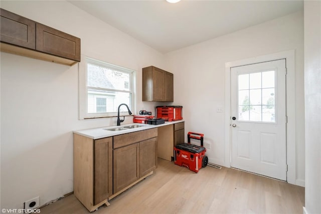 802 22nd Ave SW, Cedar Rapids, IA 52404 - kitchen with light wood-type flooring, healthy amount of natural light, and light countertops