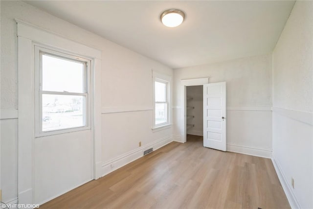 802 22nd Ave SW, Cedar Rapids, IA 52404 - unfurnished bedroom with light wood finished floors and baseboards