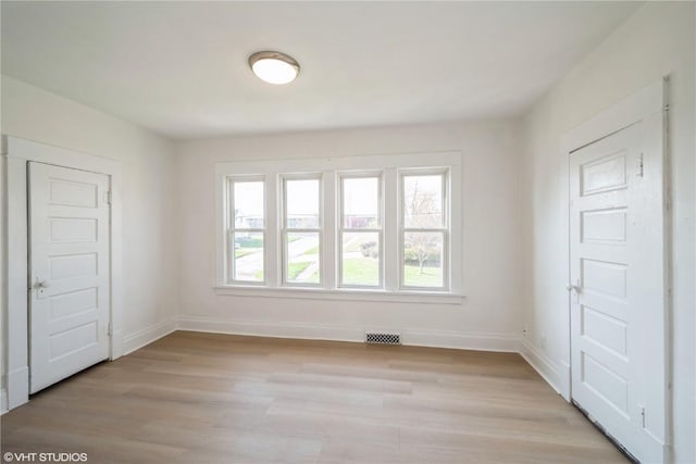 802 22nd Ave SW, Cedar Rapids, IA 52404 - unfurnished room featuring light wood finished floors and baseboards