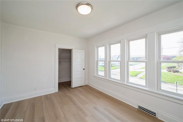 802 22nd Ave SW, Cedar Rapids, IA 52404 - unfurnished bedroom with light wood-type flooring and a closet