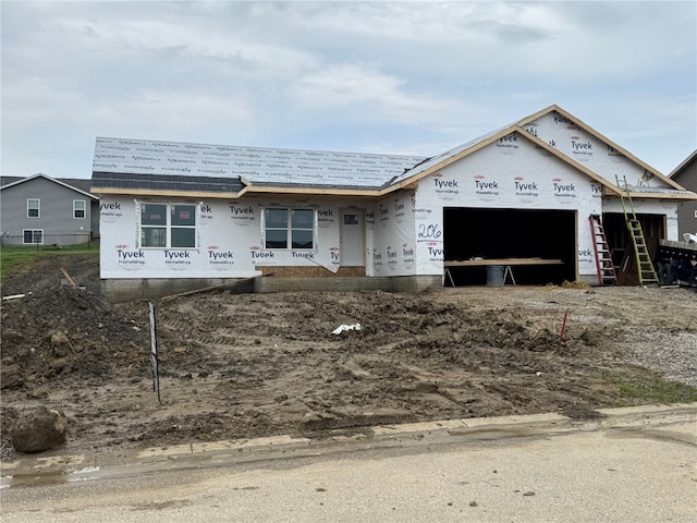 unfinished property with an attached garage