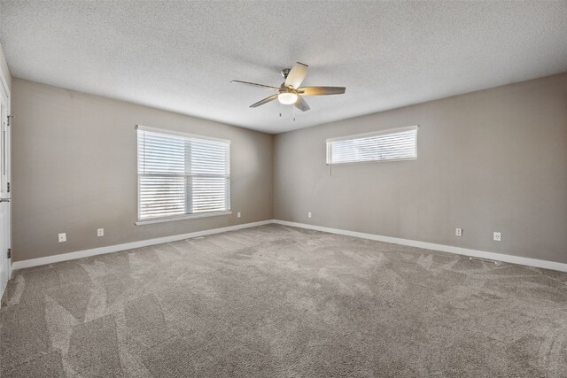 6400 Cakebread Ct, Marion, IA 52302 - carpeted spare room featuring a textured ceiling, baseboards, and ceiling fan