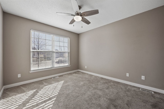 6400 Cakebread Ct, Marion, IA 52302 - carpeted spare room with ceiling fan, baseboards, a textured ceiling, and visible vents