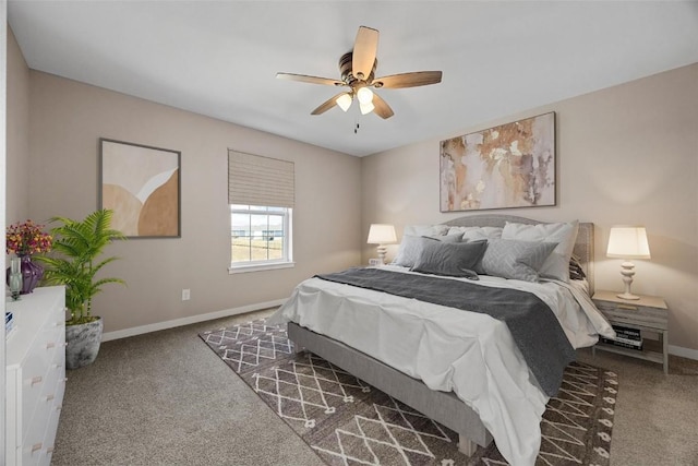 carpeted bedroom featuring baseboards and ceiling fan