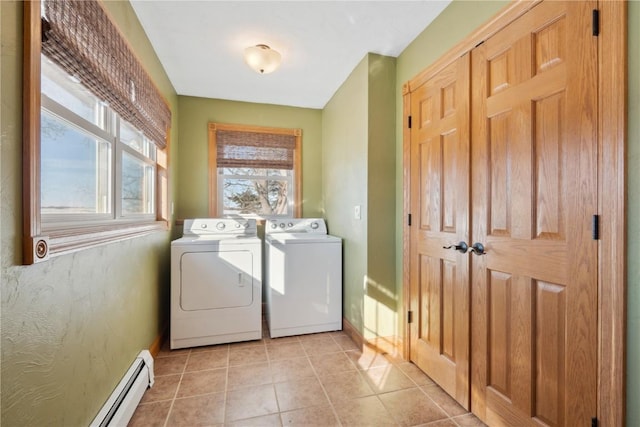 laundry area with separate washer and dryer, laundry area, a baseboard radiator, baseboards, and light tile patterned flooring