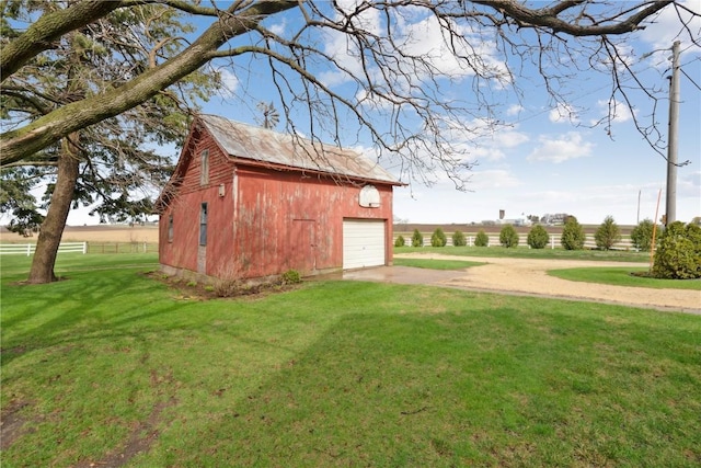 view of outbuilding with an outdoor structure and driveway