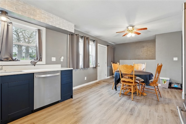 404 Main St, Shellsburg, IA 52332 - dining area featuring ceiling fan, baseboards, and light wood-type flooring