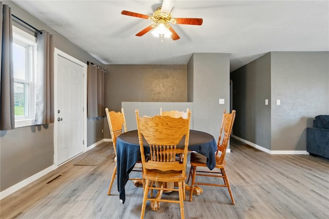 404 Main St, Shellsburg, IA 52332 - dining space featuring baseboards, a healthy amount of sunlight, and light wood finished floors