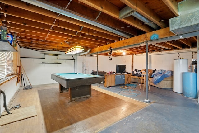 404 Main St, Shellsburg, IA 52332 - playroom featuring concrete block wall, pool table, concrete floors, and water heater