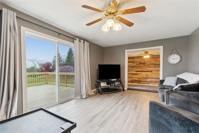 404 Main St, Shellsburg, IA 52332 - living room with baseboards, ceiling fan, and wood finished floors