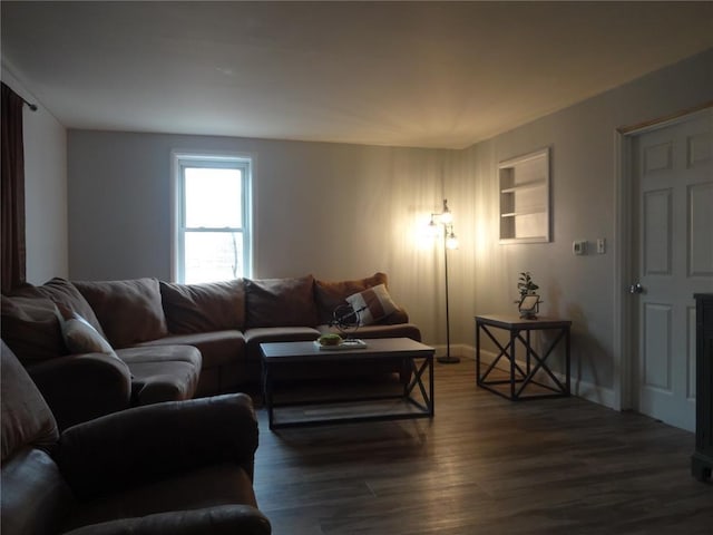 living area with wood finished floors and baseboards