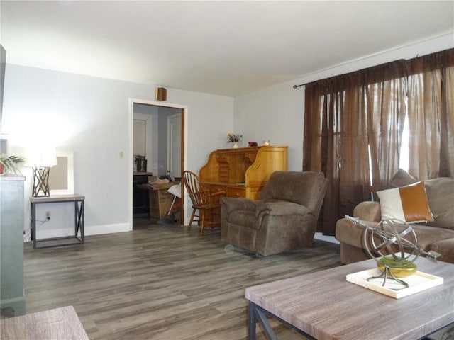 living room with wood finished floors and baseboards