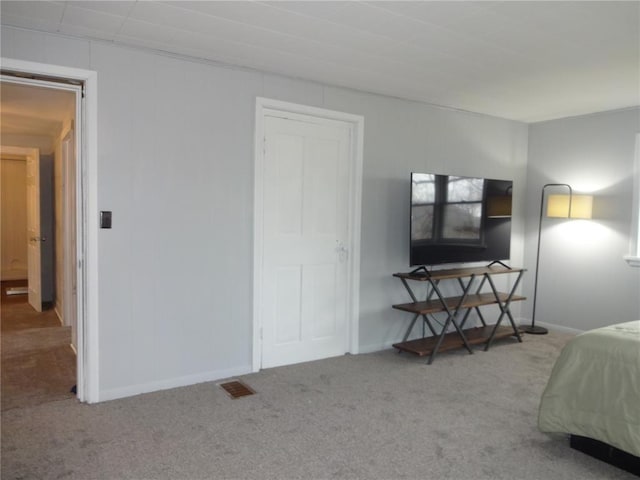 bedroom featuring visible vents, carpet flooring, and baseboards