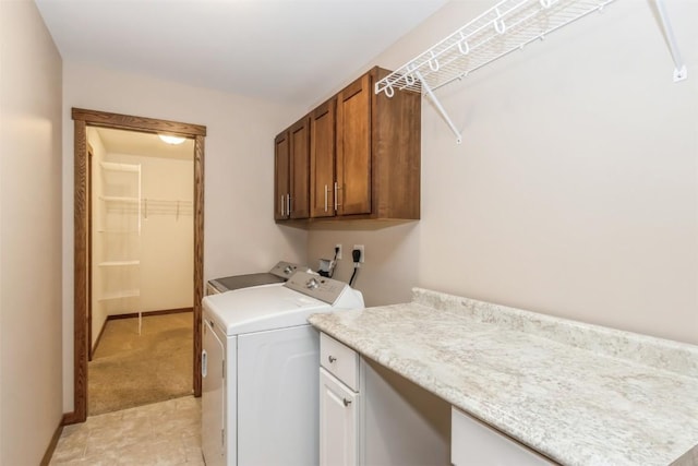 laundry area with cabinet space and washer and clothes dryer