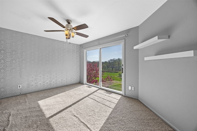 1156 Cambria Ct, Iowa City, IA 52246 - carpeted spare room with baseboards and a ceiling fan