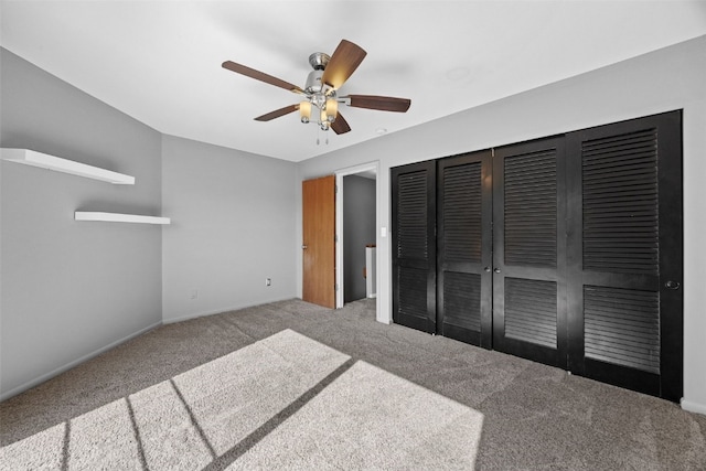 1156 Cambria Ct, Iowa City, IA 52246 - unfurnished bedroom with baseboards, ceiling fan, a closet, and carpet flooring